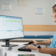 health professional on computer - hero image
