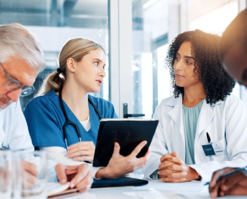 Woman, doctors and critical care team with tablet at hospital, Digital Advanced Practice Providers model