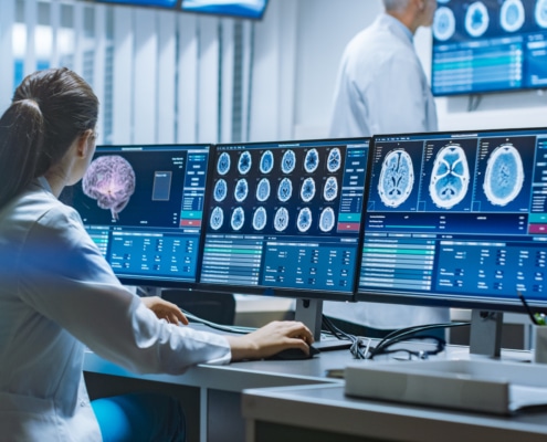 Team of Neurologists Monitoring Stroke Patients / Reviewing CT, MRI Scans