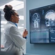 Confident Neurologist Reviewing MRI Brain Scans, Neurology