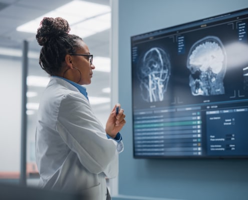 Confident Neurologist Reviewing MRI Brain Scans, Neurology